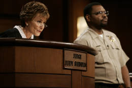 Judge Judy Sheindlin presides over a case as her bailiff Petri Hawkins Byrd listens on the set of her syndicated show "Judge Judy," Thursday, Feb. 2, 2006, at the Tribune Studios in Los Angeles. (AP Photo/Damian Dovarganes)