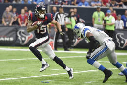 Houston Texans wide receiver Will Fuller (15) tries to evade the tackle of Detroit Lions cornerback Adairius Barnes (38) during the first half of an NFL football game Sunday, Oct. 30, 2016, in Houston. (AP Photo/Eric Christian Smith)