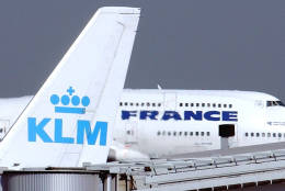FILE -- In this Sept. 30, 2003 file photo, an Air France jumbo jet rolls behind the tail of a KLM Royal Dutch airliner at Charles de Gaulle airport in Roissy, north of Paris. KLM said Wednesday, Sept. 14, 2016 that it will temporarily suspend flights to and from Cairo in January, citing “economic reasons.” The Royal Dutch Airlines’ statement said the devaluation of the Egyptian pound and restrictions imposed by the country’s central bank on the transfer of foreign currency out of Egypt are behind the decision. (AP Photo/Remy de la Mauviniere, File)
