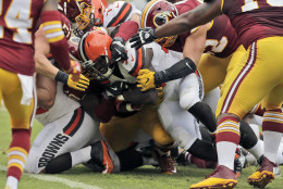 Cleveland Browns running back Isaiah Crowell, center, lunges to score a touchdown during the first half of an NFL football game against the Washington Redskins, Sunday, Oct. 2, 2016, in Landover, Md. (AP Photo/Chuck Burton)