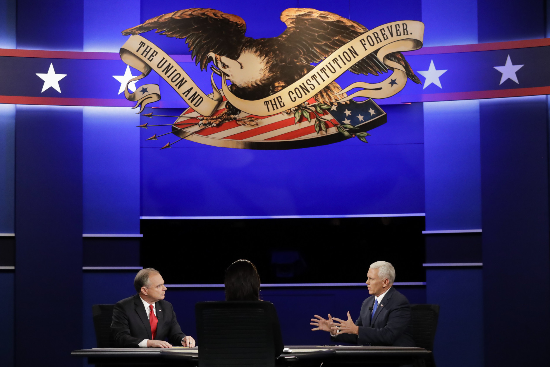 Republican vice-presidential nominee Gov. Mike Pence answers a questions as Democratic vice-presidential nominee Sen. Tim Kaine listens during the vice-presidential debate at Longwood University in Farmville, Va., Tuesday, Oct. 4, 2016. (AP Photo/David Goldman)