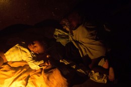 Children sleep in a shelter in Les Cayes, Haiti, Wednesday, Oct. 5, 2016. Hurricane Matthew slammed into Haiti's southwestern tip with howling, 145 mph winds destroying the bridge and cutting off road communication with the worst hit areas. ( AP Photo/Dieu Nalio Chery)