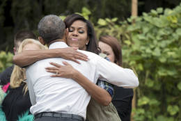 President Barack Obama hugs first lady Michelle Obama, during a surprise visit at the harvest of the White House Kitchen Garden on the South Lawn in Washington, Thursday, Oct. 6, 2016.   (AP Photo/Manuel Balce Ceneta)