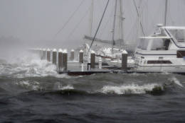 Waves from Hurricane Matthew batter a boat dock Friday, Oct. 7, 2016, in St. Augustine , Fla.  Matthew was downgraded to a Category 3 hurricane overnight, and its storm center hung just offshore as it moved up the Florida coastline, sparing communities its full 120 mph winds.  (AP Photo/John Bazemore)