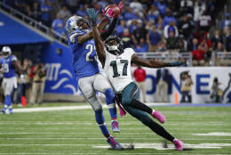 Detroit Lions cornerback Darius Slay (23) intercepts a pass intended for Philadelphia Eagles wide receiver Nelson Agholor (17) in the fourth quarter of an NFL football game, Sunday, Oct. 9, 2016, in Detroit. Detroit defeated Philadelphia 24-23. (AP Photo/Paul Sancya)