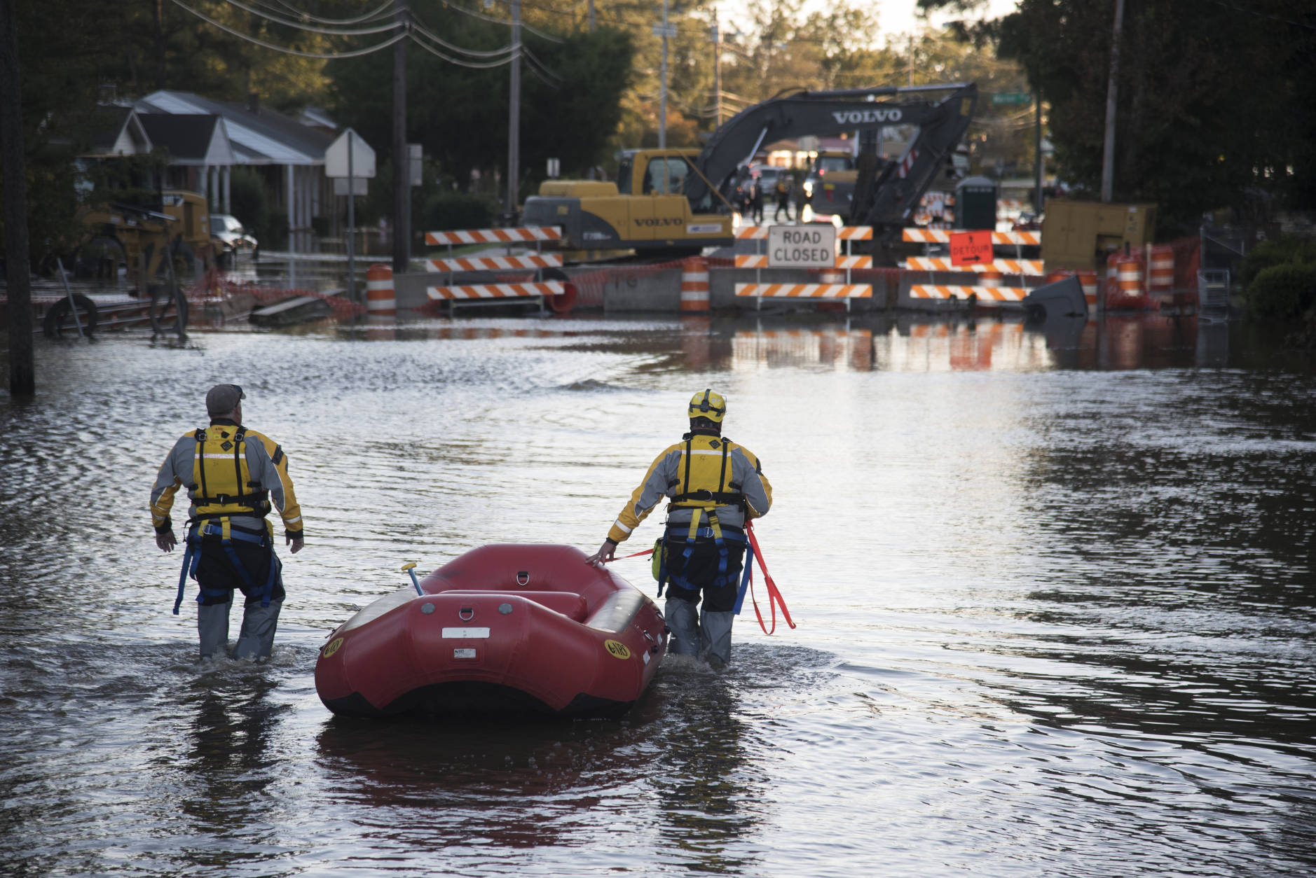 A swift water rescue team down a street covered by floodwaters caused by rain from Hurricane Matthew in Lumberton, N.C., Monday, Oct. 10, 2016. (AP Photo/Mike Spencer)