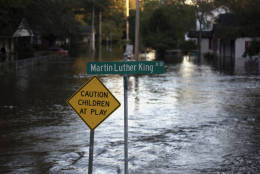 Floodwaters caused by rain from Hurricane Matthew cover Martin Luther King Jr. Drive in Lumberton, N.C., Monday, Oct. 10, 2016. (AP Photo/Mike Spencer)