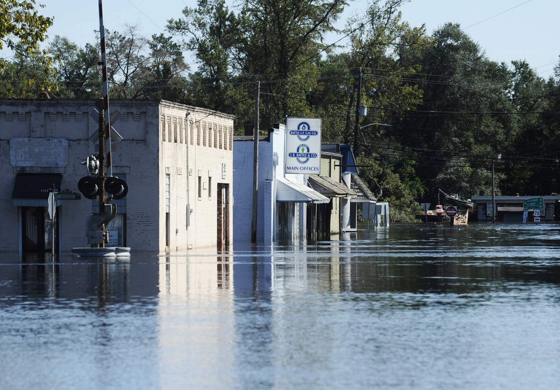 Floodwaters surround downtown Nichols, S.C. on Tuesday, Oct. 11, 2016.  About 150 people were rescued by boats from flooding in the riverside village of Nichols on Monday. (AP Photo/Rainier Ehrhardt)