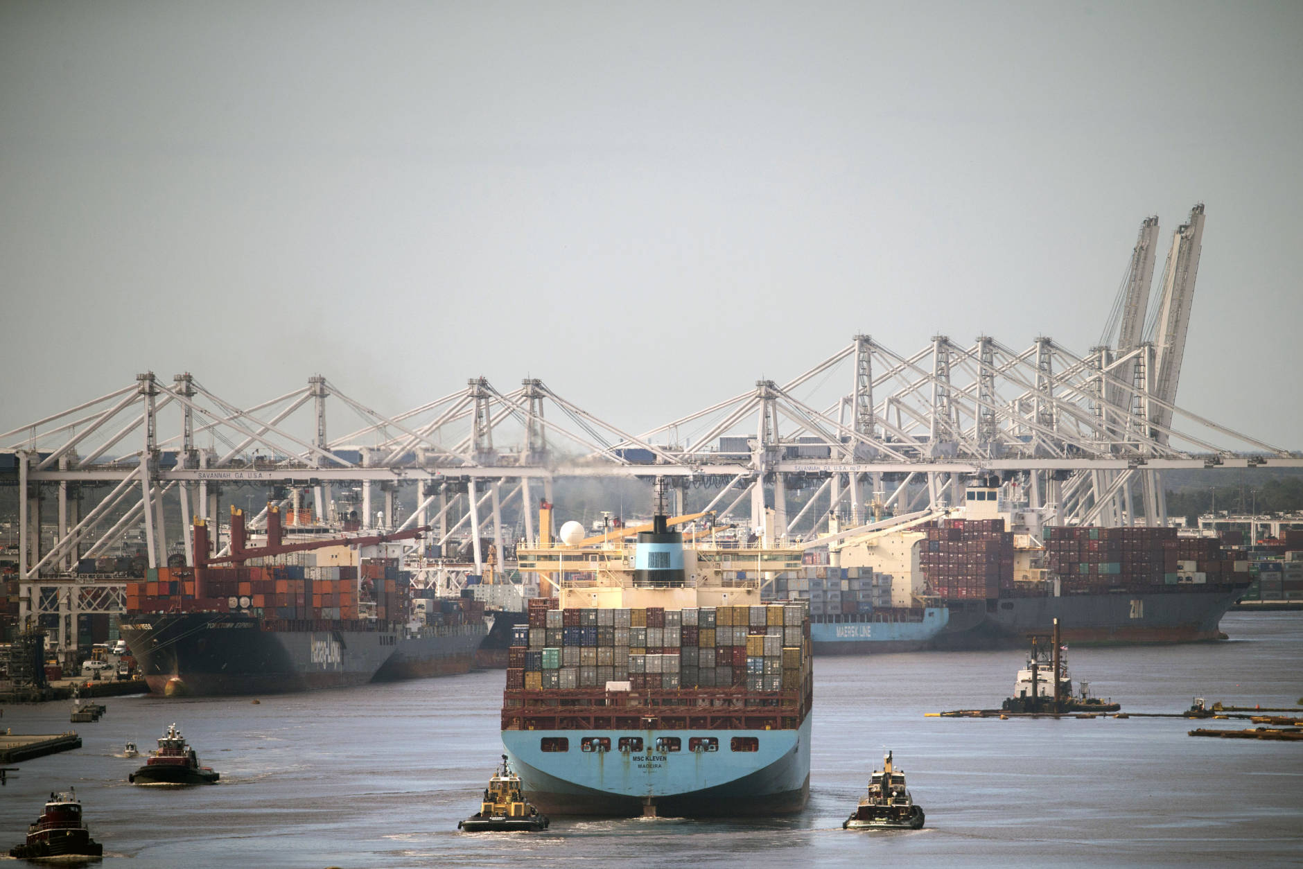In this photo provided by the Georgia Port Authority, The container ship MSC Kleven sails up the Savannah River to the Port of Savannah after it reopened following Hurricane Matthew in Savannah, Ga., Wednesday, Oct. 12, 2016. The storm forced the nation's fourth-busiest container port to shut down for several days during the peak season, when retailers are importing their holiday inventories. (Stephen Morton/Georgia Port Authority via AP)