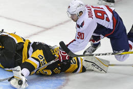 Pittsburgh Penguins goalie Marc-Andre Fleury (29) makes a save against Washington Capitals left wing Marcus Johansson (90), of Sweden,  during the third period of an NHL hockey game Thursday, Oct. 13, 2016, in Pittsburgh, Pa. (AP Photo/Fred Vuich)