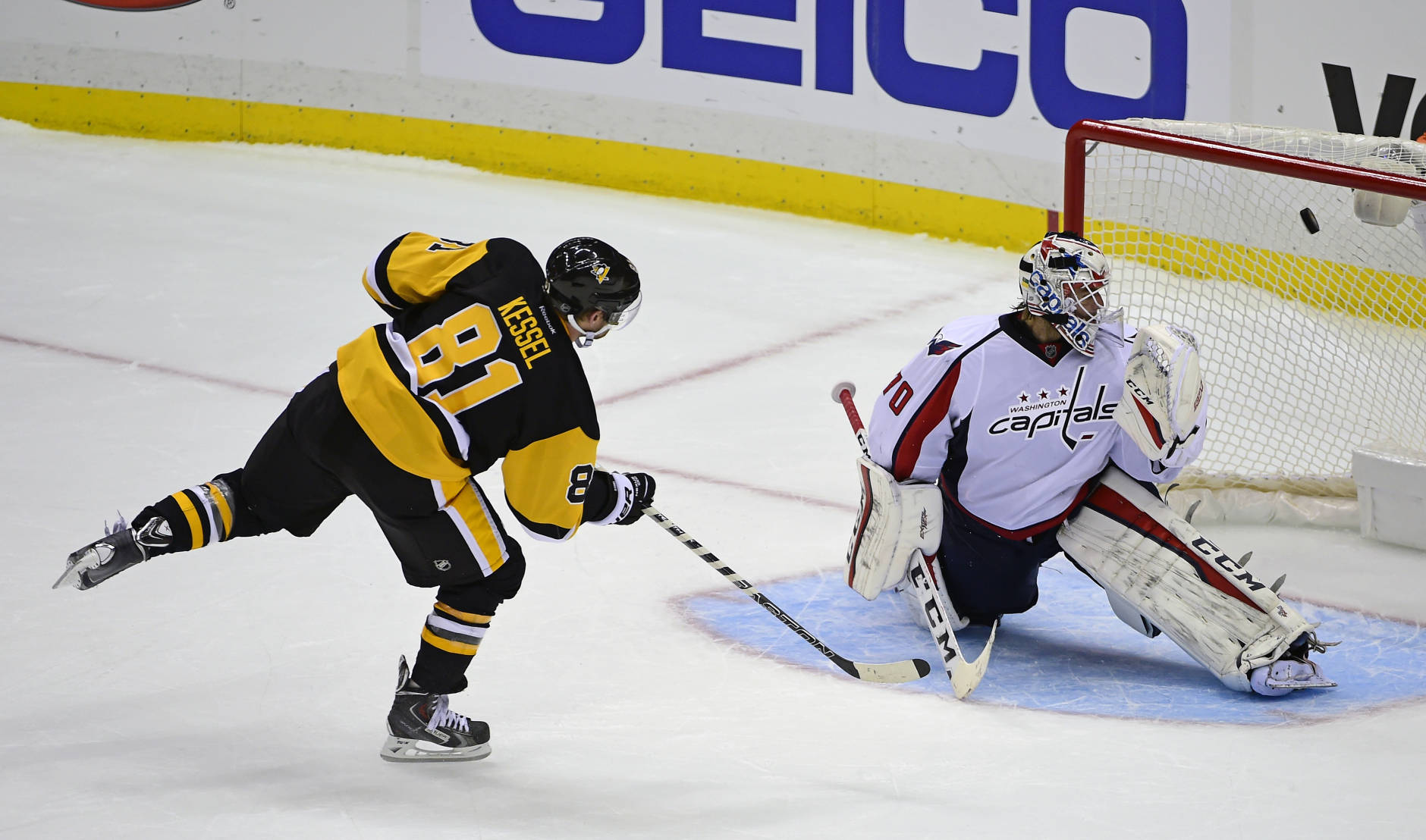 Pittsburgh Penguins right wing Phil Kessel (81) scores on Washington Capitals goalie Braden Holtby (70) during the shootout in an NHL hockey game Thursday, Oct. 13, 2016, in Pittsburgh. The Penguins won 3-2. (AP Photo/Fred Vuich)