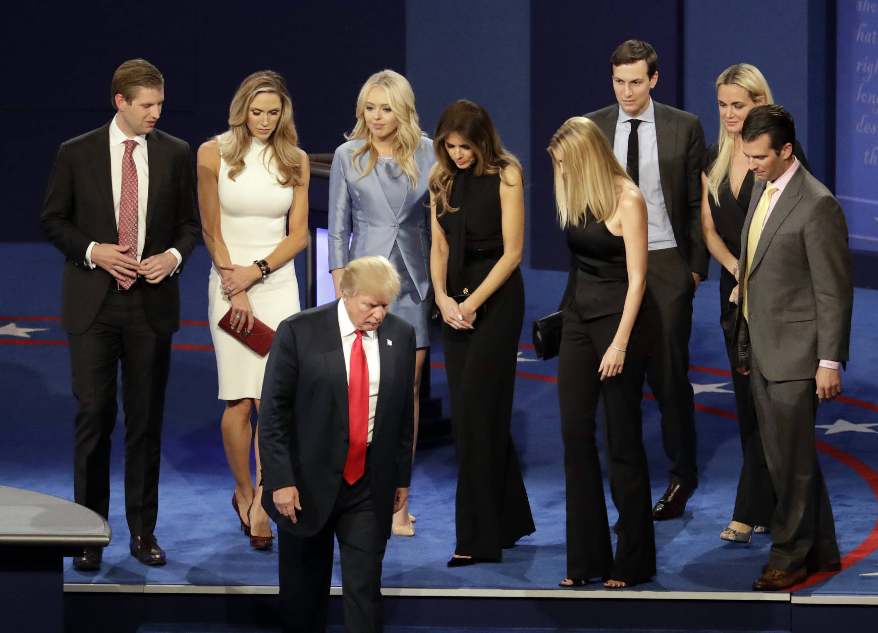 Republican presidential nominee Donald Trump walks off the stage with his family after debating Democratic presidential nominee Hillary Clinton at the end of the third presidential debate at UNLV in Las Vegas, Wednesday, Oct. 19, 2016. (AP Photo/Julio Cortez)