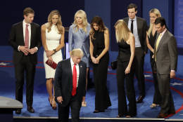 Republican presidential nominee Donald Trump walks off the stage with his family after debating Democratic presidential nominee Hillary Clinton at the end of the third presidential debate at UNLV in Las Vegas, Wednesday, Oct. 19, 2016. (AP Photo/Julio Cortez)