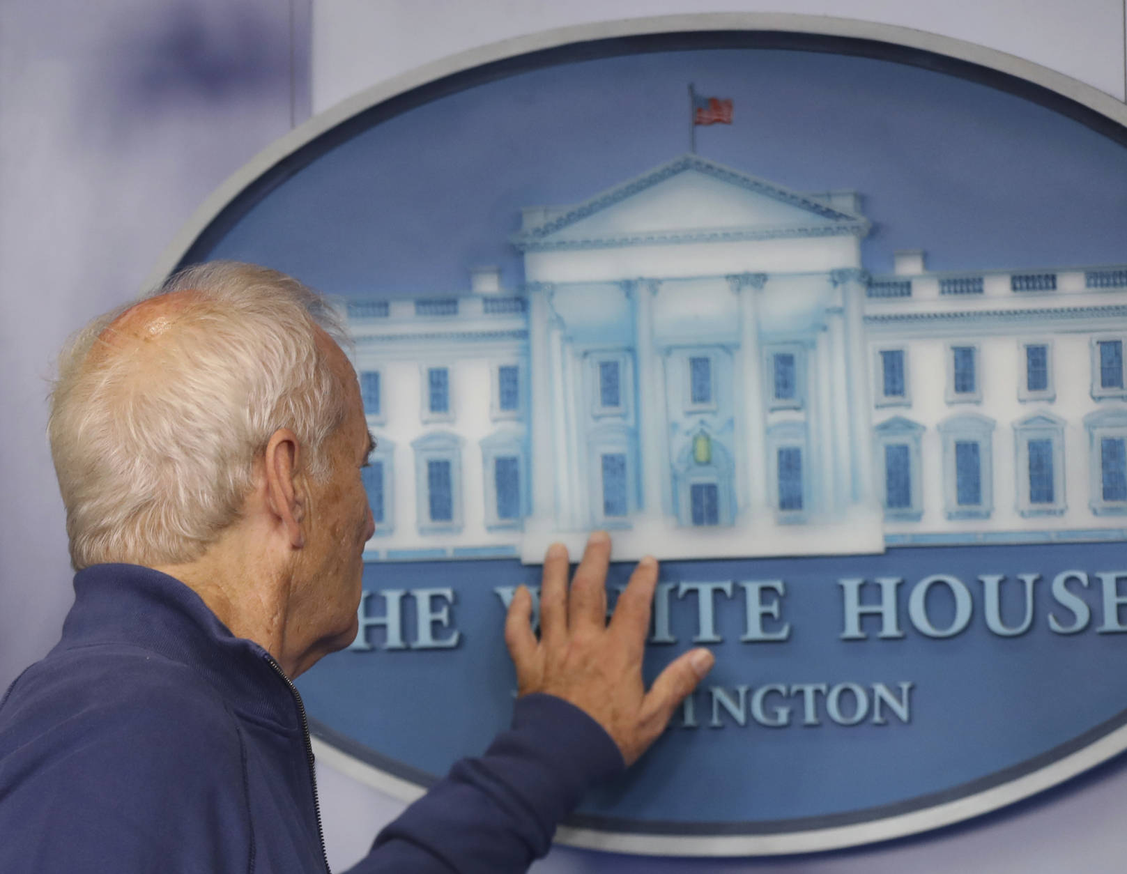 Actor Bill Murray touches to White House sign during a brief visit in the Brady Press Briefing Room of the White House in Washington, Friday, Oct. 21, 2016. Murray is in Washington to receive the Mark Twain Prize for American Humor.  (AP Photo/Manuel Balce Ceneta)