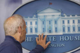 Actor Bill Murray touches to White House sign during a brief visit in the Brady Press Briefing Room of the White House in Washington, Friday, Oct. 21, 2016. Murray is in Washington to receive the Mark Twain Prize for American Humor.  (AP Photo/Manuel Balce Ceneta)