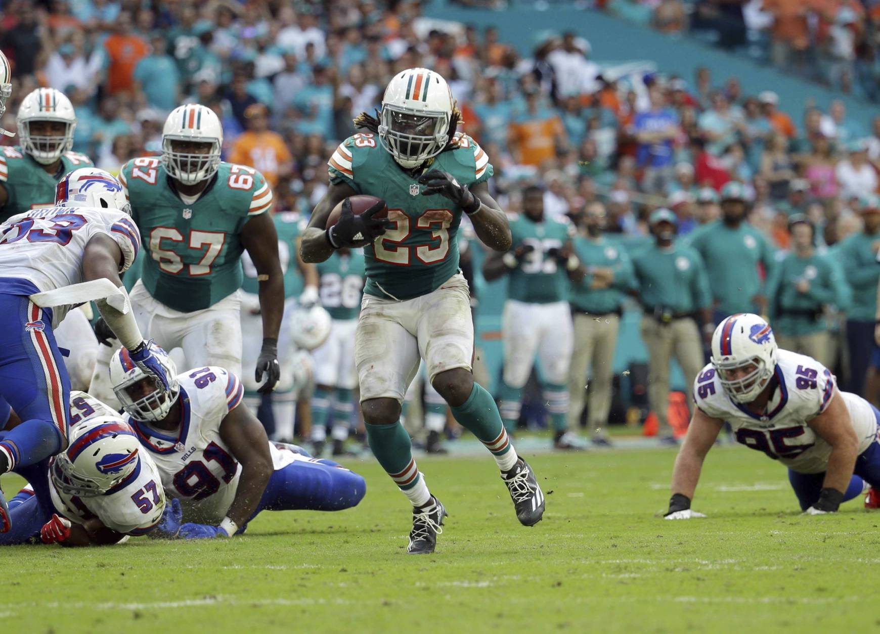 Miami Dolphins running back Jay Ajayi (23) runs the ball, during the second half of an NFL football gam against the Buffalo Bills, Sunday, Oct. 23, 2016, in Miami Gardens, Fla. (AP Photo/Lynne Sladky)