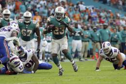 Miami Dolphins running back Jay Ajayi (23) runs the ball, during the second half of an NFL football gam against the Buffalo Bills, Sunday, Oct. 23, 2016, in Miami Gardens, Fla. (AP Photo/Lynne Sladky)