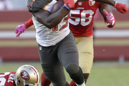 Tampa Bay Buccaneers running back Peyton Barber (43) runs for a touchdown against the San Francisco 49ers during the second half of an NFL football game in Santa Clara, Calif., Sunday, Oct. 23, 2016. (AP Photo/Marcio Jose Sanchez)