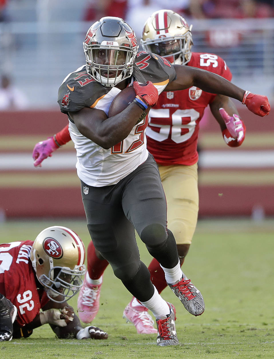 Tampa Bay Buccaneers running back Peyton Barber (43) runs for a touchdown against the San Francisco 49ers during the second half of an NFL football game in Santa Clara, Calif., Sunday, Oct. 23, 2016. (AP Photo/Marcio Jose Sanchez)