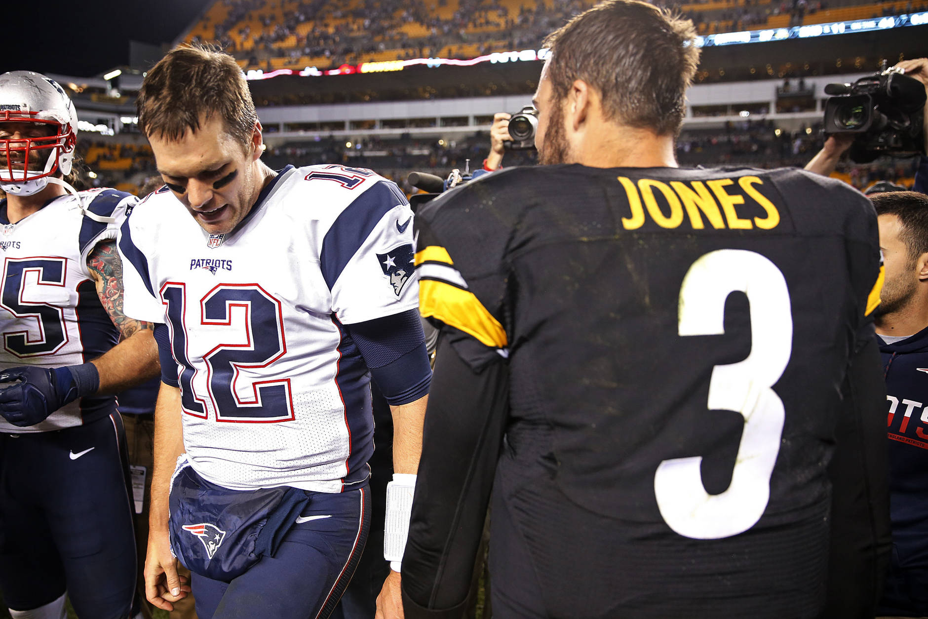 New England Patriots quarterback Tom Brady (12) talks with Pittsburgh Steelers quarterback Landry Jones (3) on the field after an NFL football game in Pittsburgh, Sunday, Oct. 23, 2016. The Patriots won 27-16. (AP Photo/Jared Wickerham)