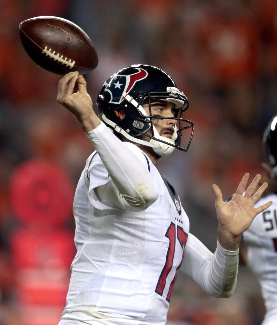 Houston Texans quarterback Brock Osweiler (17) bobbles the throw during the second half of an NFL football game against the Denver Broncos, Monday, Oct. 24, 2016, in Denver. (AP Photo/Joe Mahoney)