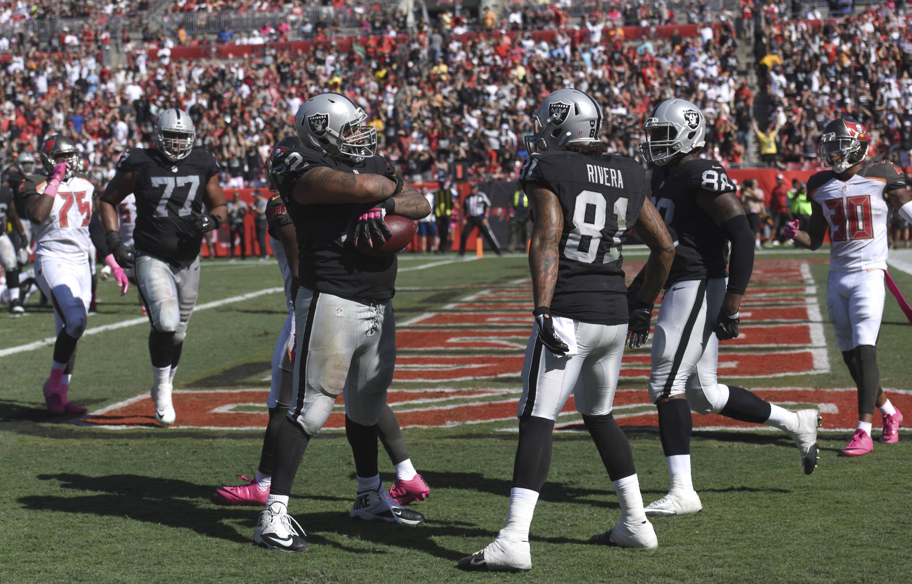 Oakland Raiders tackle Donald Penn (72) reacts after catching a 1-yard touchdown pass against the Tampa Bay Buccaneers during the third quarter of an NFL football game Sunday, Oct. 30, 2016, in Tampa, Fla. (AP Photo/Jason Behnken)