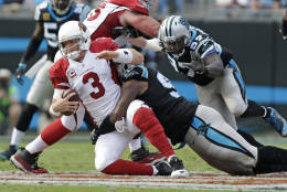 Arizona Cardinals' Carson Palmer (3) is sacked by Carolina Panthers' Kawann Short (99) in the second half of an NFL football game in Charlotte, N.C., Sunday, Oct. 30, 2016. (AP Photo/Bob Leverone)