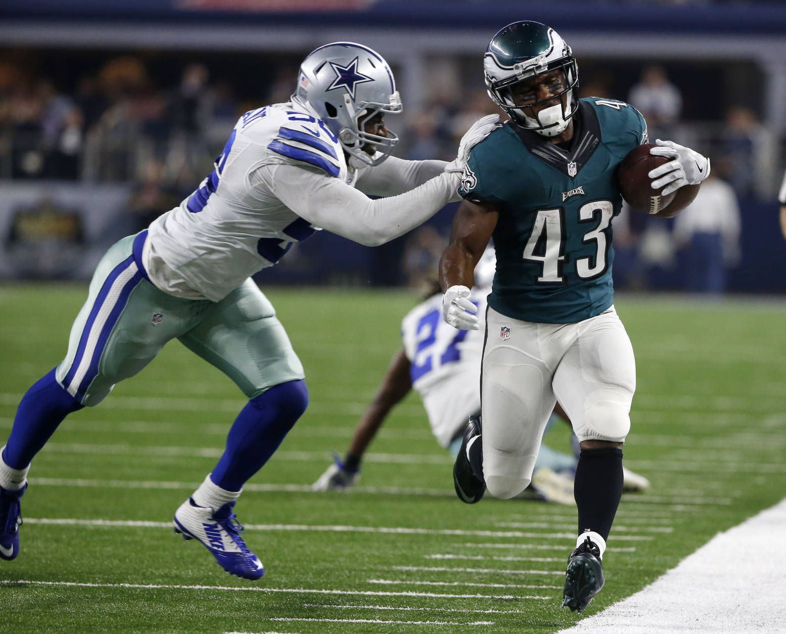 Dallas Cowboys linebacker Justin Durant (56) pushes Philadelphia Eagles running back Darren Sproles (43) out of bounds after a long run in the first half of an NFL football game, Sunday, Oct. 30, 2016, in Arlington, Texas. (AP Photo/Ron Jenkins)