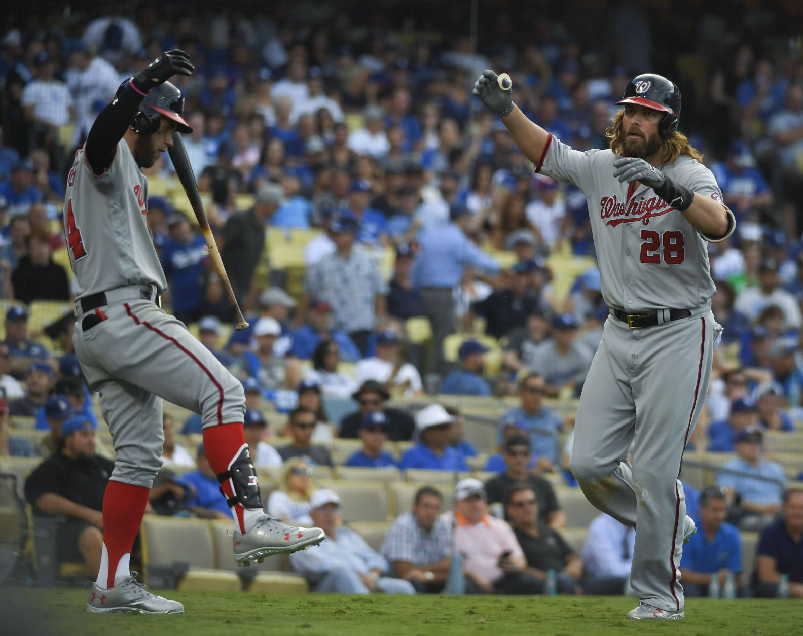 Washington Nationals' Jayson Werth, left, celebrates after his home run with Bryce Harper during the ninth inning in Game 3 of baseball's National League Division Series in Los Angeles, Monday, Oct. 10, 2016. (AP Photo/Mark J. Terrill)