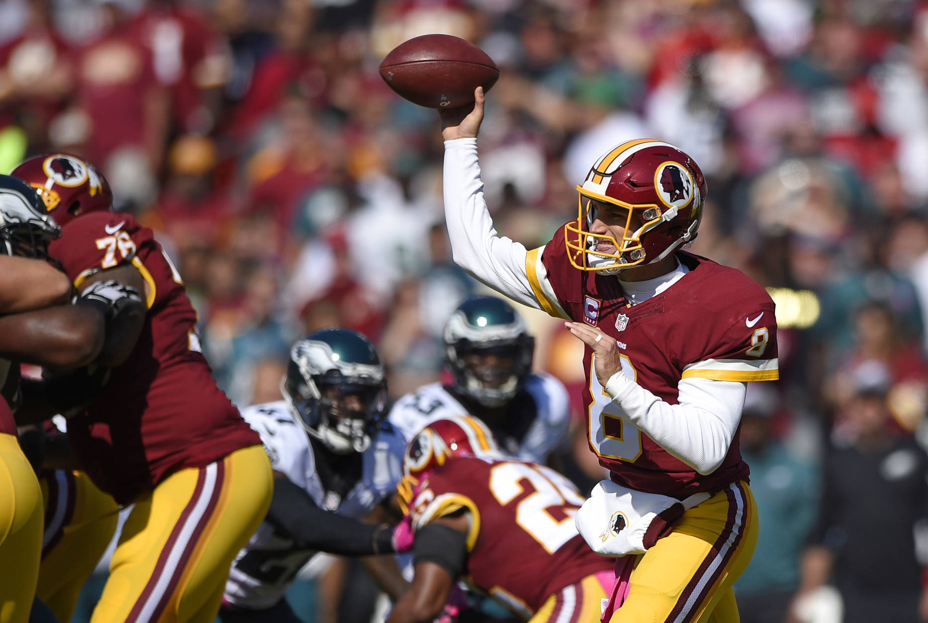 Washington Redskins quarterback Kirk Cousins throws to a receiver in the first half of an NFL football game against the Philadelphia Eagles, Sunday, Oct. 16, 2016, in Landover, Md. (AP Photo/Nick Wass)