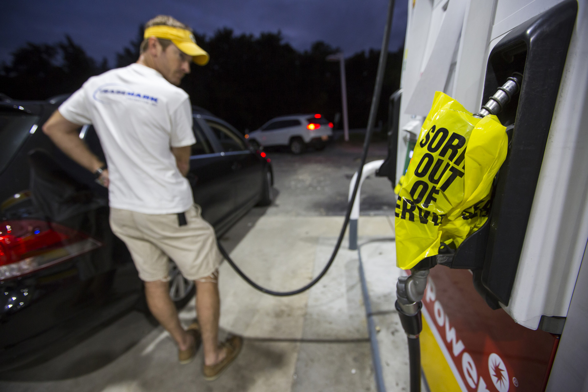 Andrew Castle fills up his car with diesel, the only gas left at a Shell station, in advance of Hurricane Matthew in Mt. Pleasant, S.C., Tuesday, Oct. 4, 2016 Hurricane Matthew is expected to affect the South Carolina coast by the weekend. "Couldn't get gas at any other place," Castle said. Gov. Nikki Haley announced Tuesday that, unless the track of the storm changes, the state will issue an evacuation order Wednesday ahead of Hurricane Matthew so that 1 million people can safely and comfortably leave the coast.  (AP Photo/Mic Smith)