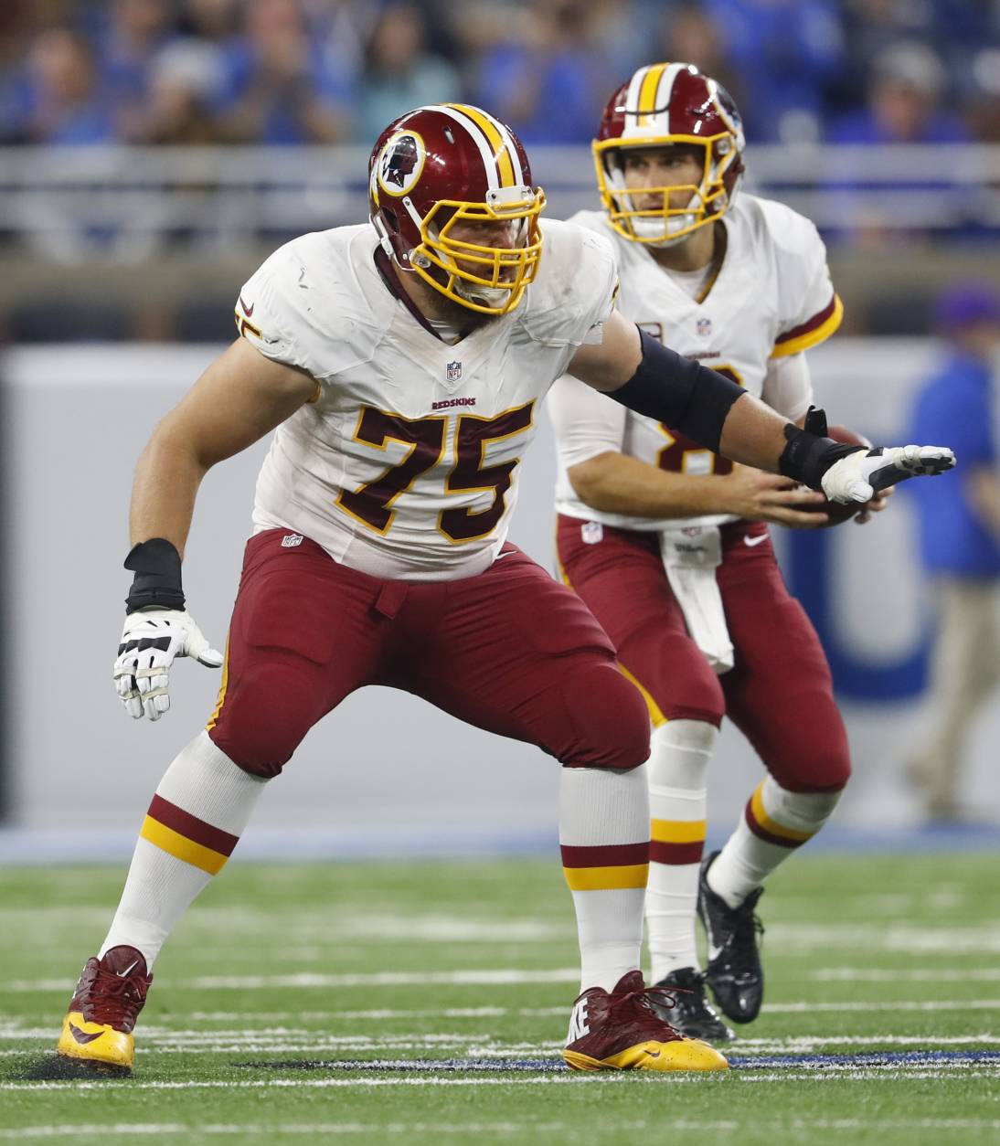 Washington Redskins offensive guard Brandon Scherff (75) protects quarterback Kirk Cousins during the second half of an NFL football game against the Detroit Lions, Sunday, Oct. 23, 2016 in Detroit. (AP Photo/Paul Sancya)