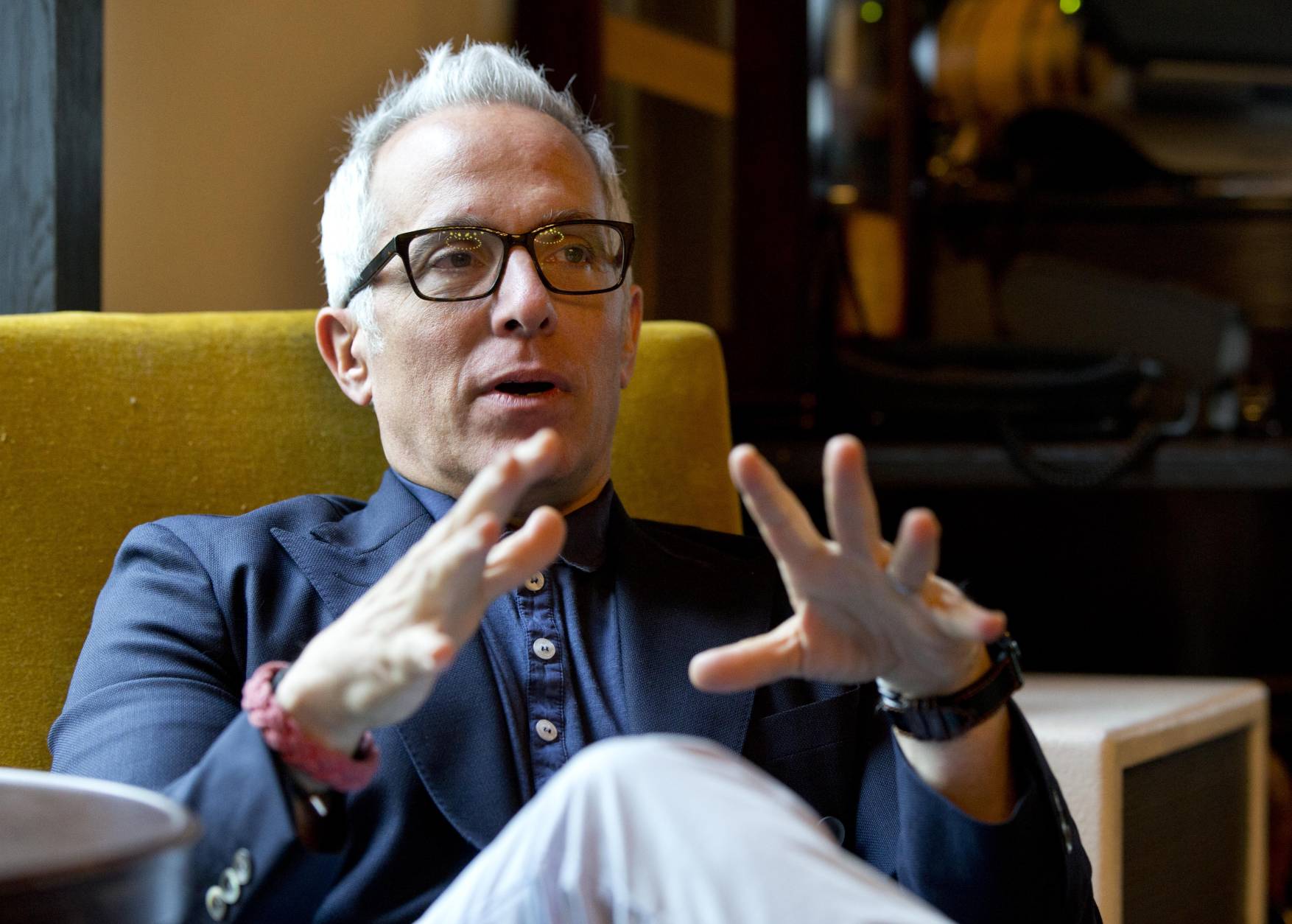 Chef Geoffrey Zakarian gestures as he speaks during an interview with The Associated Press, Friday, Feb. 20, 2015, in Miami Beach, Fla. Now honored with an Iron Chef title, a judging seat on "Chopped" and a best-selling cookbook, Zakarian says opening a restaurant is a lot like playing poker. "It's a crap shoot. We gamble when we open a restaurant," said Zakarian, whose restaurants include The Lambs Club and The National. (AP Photo/Wilfredo Lee)