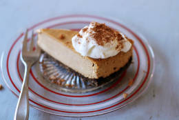 This Nov. 2, 2015 photo shows warm pumpkin bourbon cheesecake in Concord, NH. Serve this cheesecake hot, right out of the oven, topped with a little vanilla ice cream or sweetened whipped cream(AP Photo/Matthew Mead)