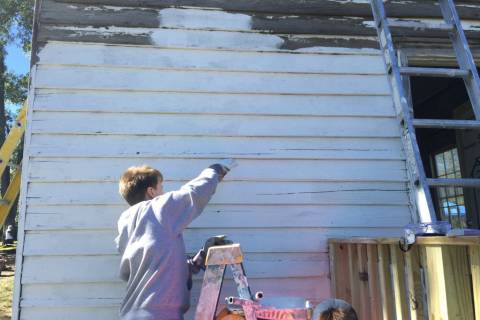 Hundreds show up to restore vandalized schoolhouse