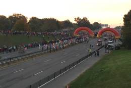 Runners are lined up for the start of the Marine Corps Marathon. (WTOP/Dennis Foley)