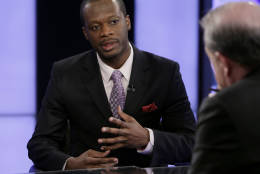 Haitian American singer Pras Michel, formerly of the Fugees, is interviewed on "Varney &amp; Co." by program host Stuart Varney, right, on the Fox Business Network, in New York, Monday, April 11, 2011. (AP Photo/Richard Drew)