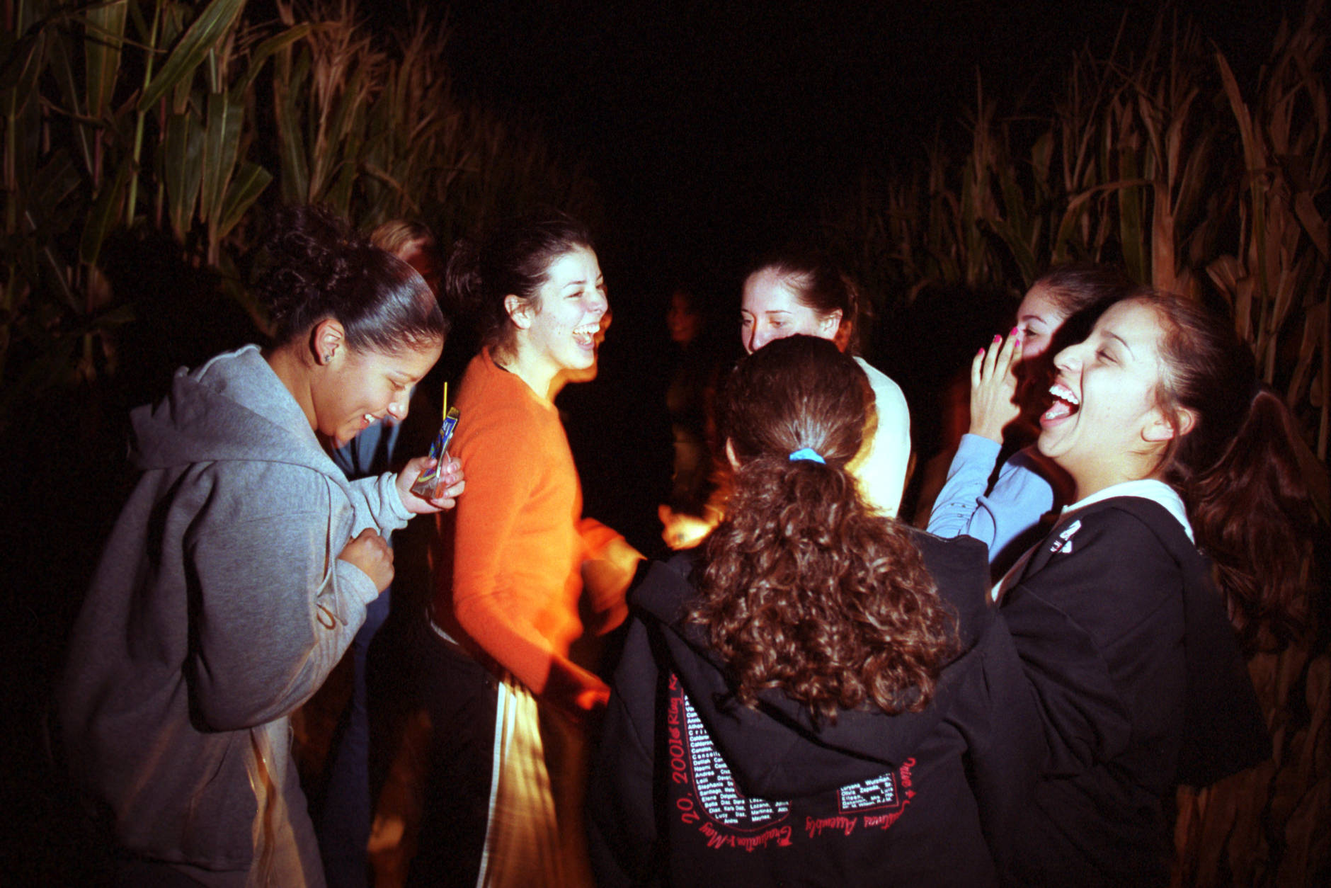 381329 06: A group of girls laugh together as they try navigate through a 10 acre cornfield maze October 19, 2000 in La Union, NM. The local farmer who built the maze is one of many using tourism as a way to supplement their income. The maze was designed using a GPS system to mark out the trail. (Photo by Joe Raedle/Newsmakers)