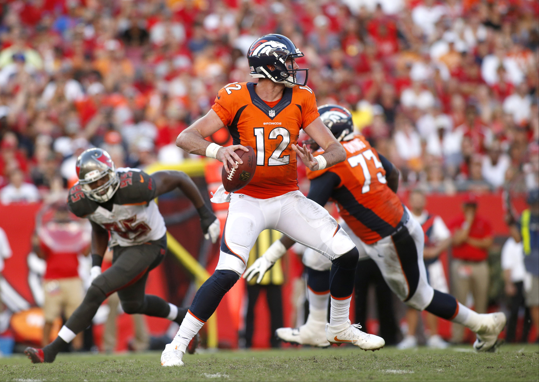 TAMPA, FL - OCTOBER 2:  Quarterback Paxton Lynch #12 of the Denver Broncos looks for an open receiver during the third quarter of an NFL game against the Tampa Bay Buccaneers on October 2, 2016 at Raymond James Stadium in Tampa, Florida. (Photo by Brian Blanco/Getty Images)