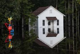 LUMBERTON, NC - OCTOBER 10: A building is inundated with floodwaters on October 10, 2016 in Lumberton, North Carolina. The death toll from Hurricane Matthew in the U.S. has climbed to over 20. (Photo by Sean Rayford/Getty Images)