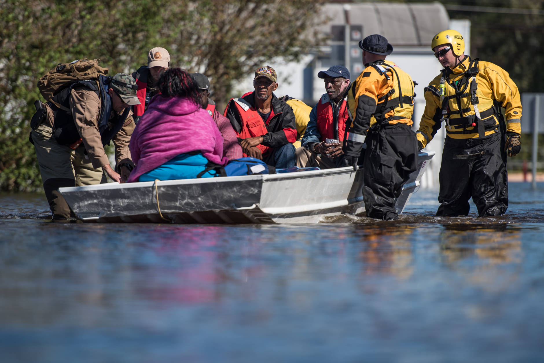 LUMBERTON, NC - OCTOBER 12: A rescue team transports residents to dry land on October 12, 2016 in Lumberton, North Carolina. Hurricane Matthew's heavy rains ended over the weekend, but flooding is still expected for days in North Carolina. (Photo by Sean Rayford/Getty Images)