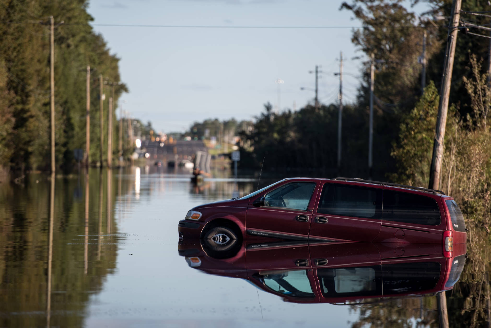 LUMBERTON, NC - OCTOBER 12: A vehicle is partially submerged by floodwaters from the Lumber River on October 12, 2016 in Lumberton, North Carolina. Hurricane Matthew's heavy rains ended over the weekend, but flooding is still expected for days in North Carolina. (Photo by Sean Rayford/Getty Images)