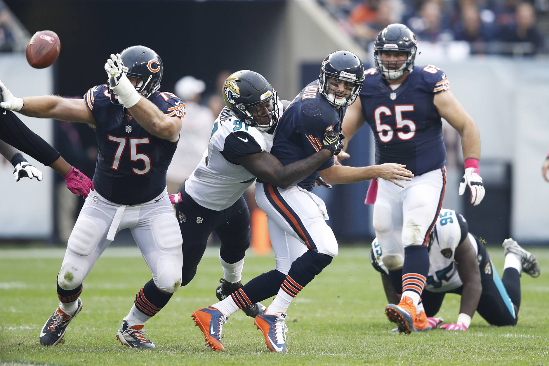 CHICAGO, IL - OCTOBER 16: Brian Hoyer #2 of the Chicago Bears loses the ball after being hit by Yannick Ngakoue #91 of the Jacksonville Jaguars in the second half of the game at Soldier Field on October 16, 2016 in Chicago, Illinois. The Jaguars defeated the Bears 17-16. (Photo by Joe Robbins/Getty Images)