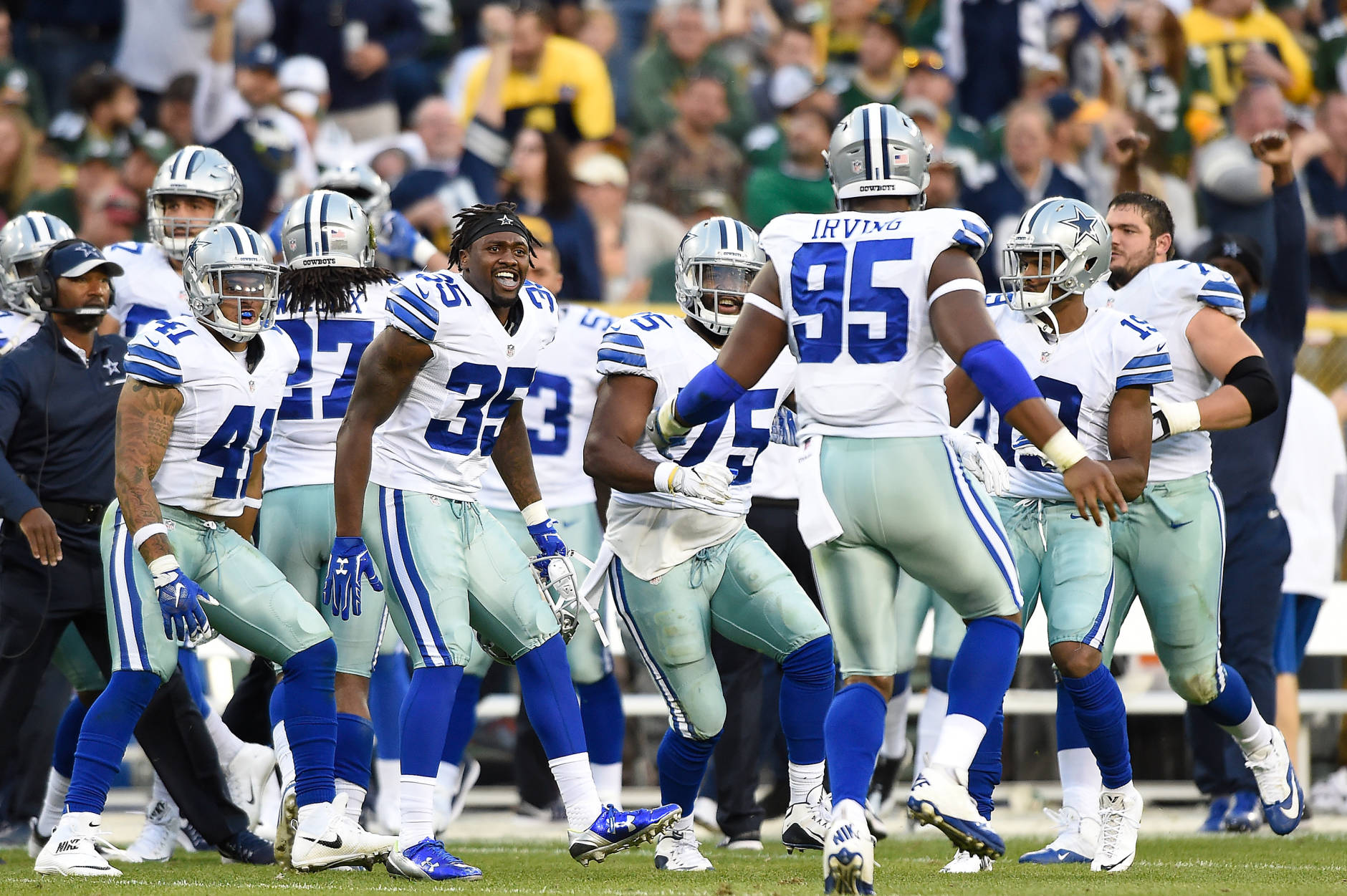 GREEN BAY, WI - OCTOBER 16:  David Irving #95 of the Dallas Cowboys celebrates with his team against the Green Bay Packers during the third quarter at Lambeau Field on October 16, 2016 in Green Bay, Wisconsin. The Dallas Cowboys defeated the Green Bay Packers 30-16.  (Photo by Hannah Foslien/Getty Images)