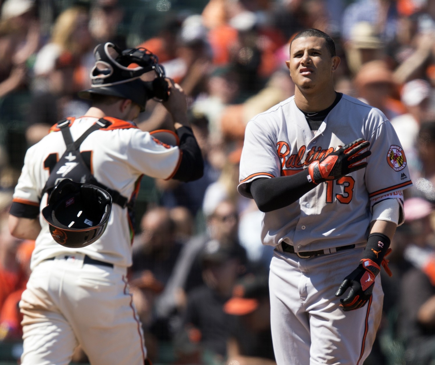Baltimore Orioles' Manny Machado (13) tosses his helmet after striking out against the San Francisco Giants during the seventh inning of a baseball game, Sunday, Aug. 14, 2016, in San Francisco. The Orioles won 8-7. (AP Photo/D. Ross Cameron)