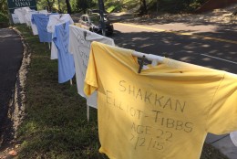 The hill that leads to Temple Sinai in D.C. is lined with T-shirts that bear the names of gun violence victims from 2015. (WTOP/Megan Cloherty