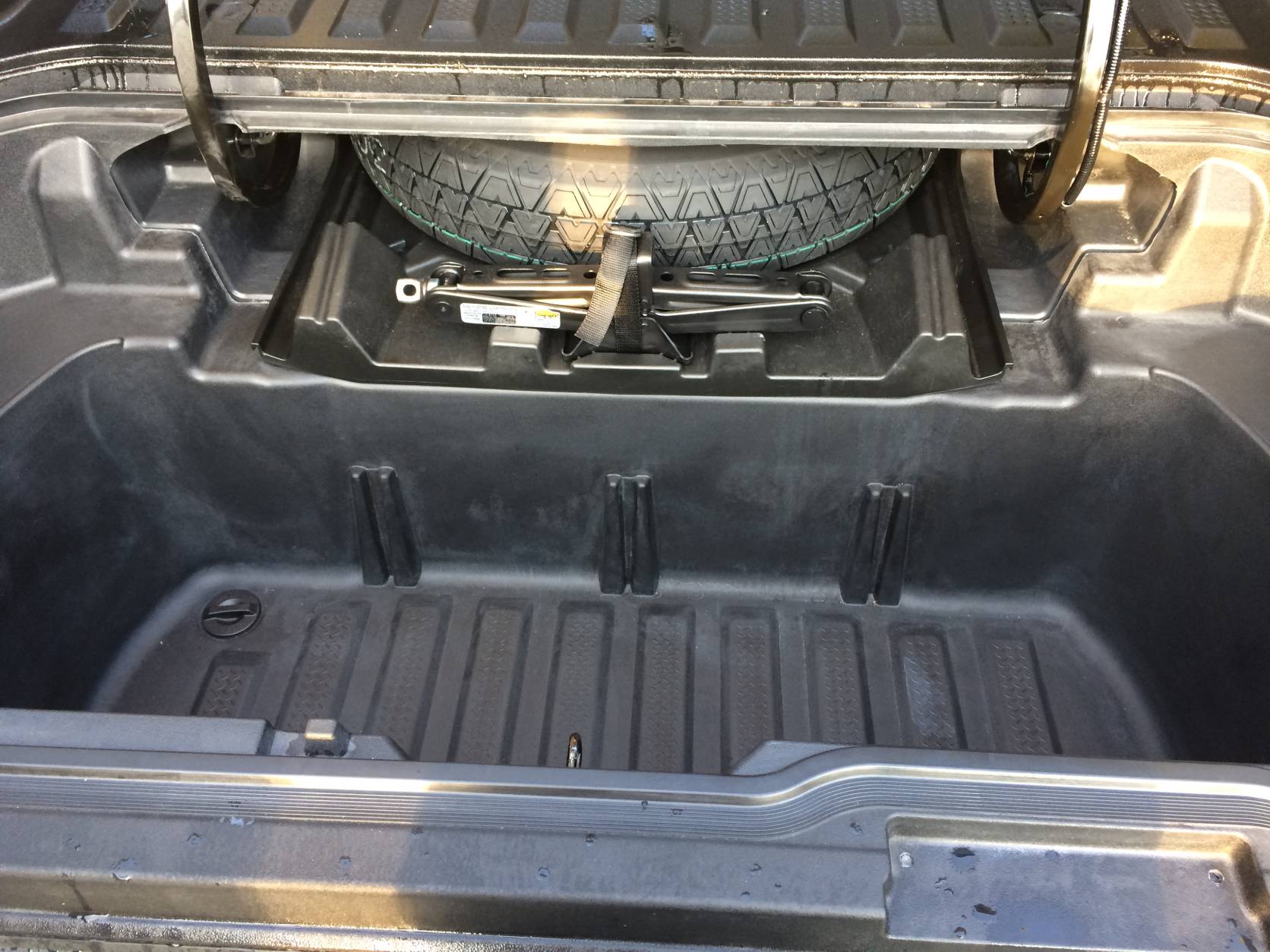 Simply open the door on the floor of the 2017 Honda Ridgeline 2017 and there’s water tight storage and a drain plug so it can be used as a cooler at tailgates.  (WTOP/Mike Parris)
