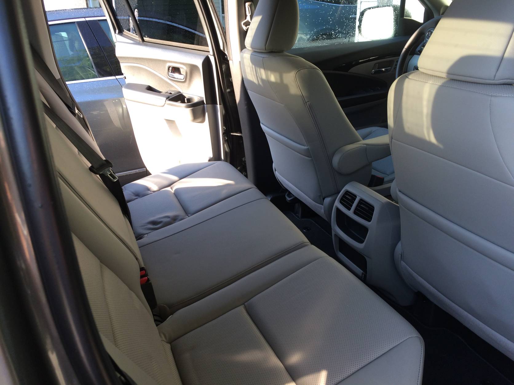 The seats of the 2017 Honda Ridgeline AWD are comfortable with leather-heated seats and the rear bench is good for three, with nice head room and adequate leg room for most passengers. (WTOP/Mike Parris)