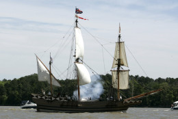 The replica 17th century sailing vessel Godspeed delivers a cannon shot salute as it passes the original site of the Jamestown settlement as it makes it's way down the James River after a sendoff for the ship in Jamestown, Va., Monday, May 22, 2006.  The ship is beginning an 80 day tour of the East Coast to help promote the 400th anniversary of the founding of Jamestown in 2007. (AP Photo/Steve Helber)