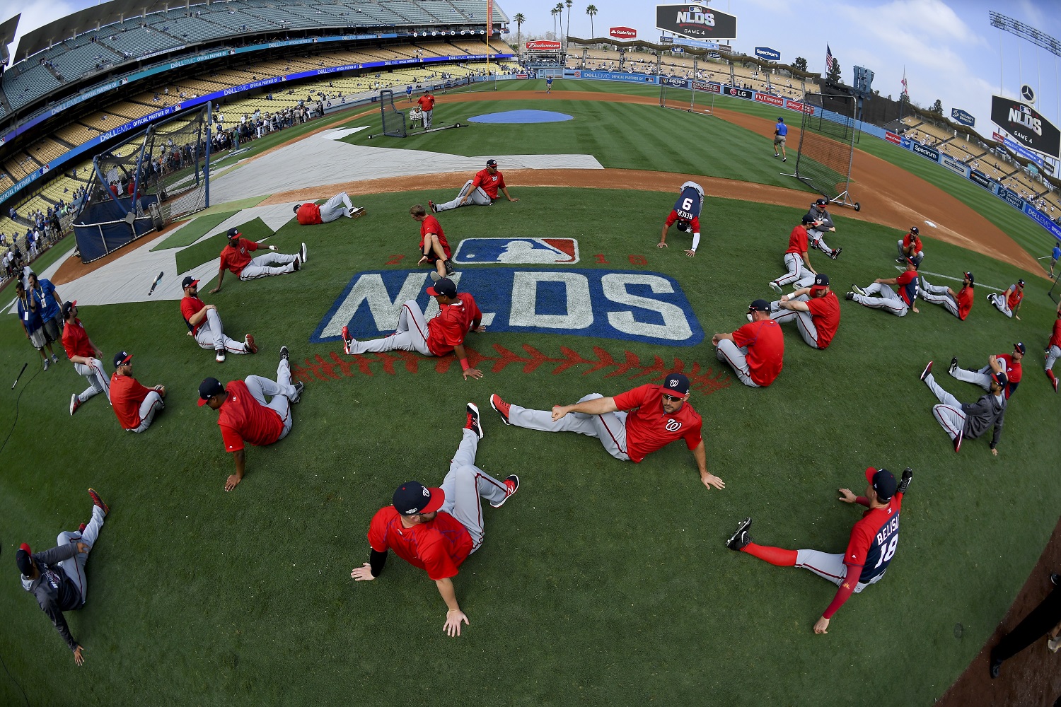 Members of the Washington Nationals warm up before Game 4 of baseball's National League Division Series against the Los Angeles Dodgers in Los Angeles, Tuesday, Oct. 11, 2016. (AP Photo/Mark J. Terrill)